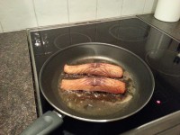 Frying the salmon for 1 - 2 minutes. Put on salt and pepper (if wanted).